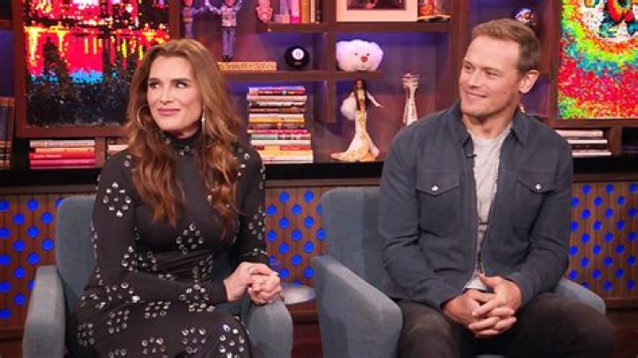 Brooke Shields & Sam Heughan Reenact Steamy ‘Outlander’ Season 3 Love Scene On ‘WWHL’ — Watch