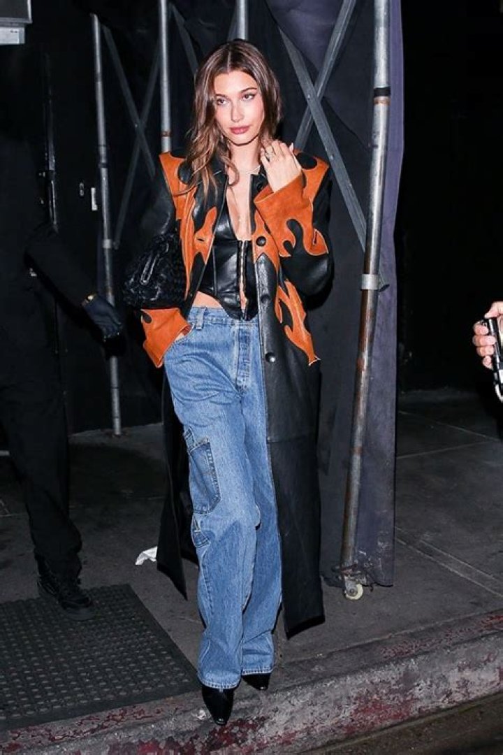 Hailey Baldwin Slays In Plunging Leather Corset Top With Baggy Jeans For Night Out – Photos