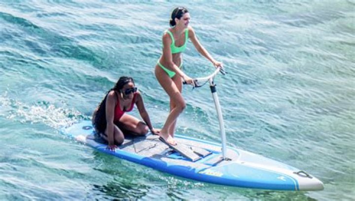 Kendall Jenner Shows Off Abs In Neon Green Bikini While Paddle Boarding: Plus, More Of Her Mykonos Bikini Looks