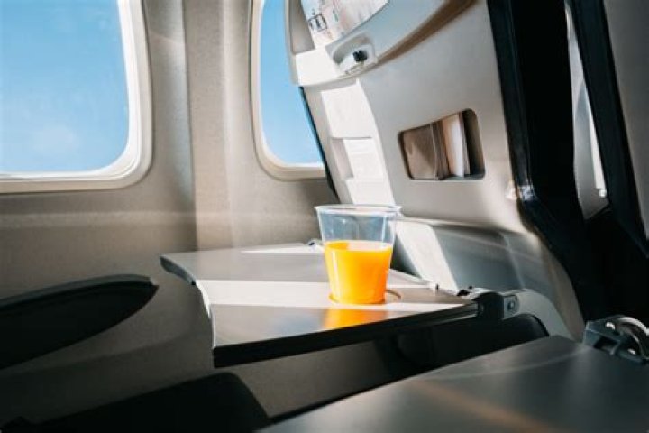 6 Things You Should Never Eat or Drink on a Plane If You're Over 60