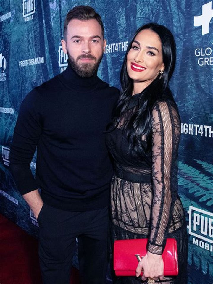 Nikki Bella Slays White Crop Top, Skirt & ‘Wife’ Hair Clip After Marrying Artem In Paris: Photos