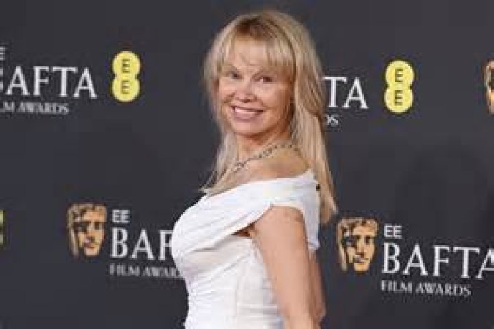 Pamela Anderson Is A Goddess In Slinky White Dress For ‘Pamela, A Love Story’ After Party: Photos