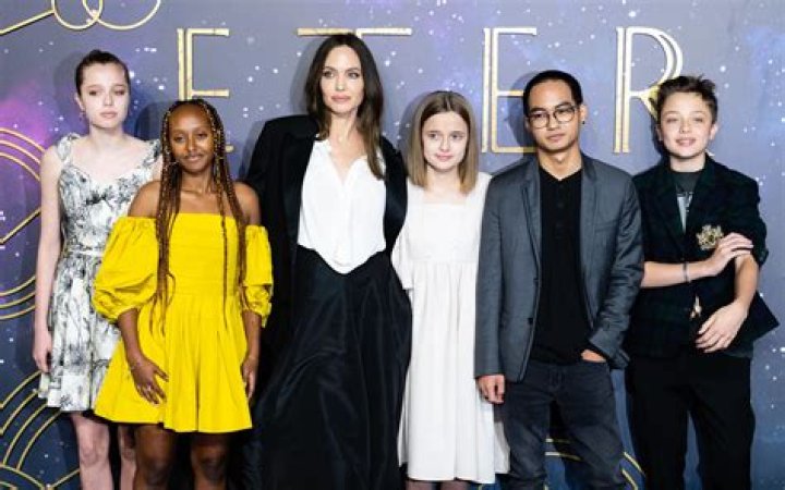 Shiloh Jolie-Pitt Rocks A Jean Jacket While Sister Zahara Wears A Yellow Dress Out With Mom Angelina